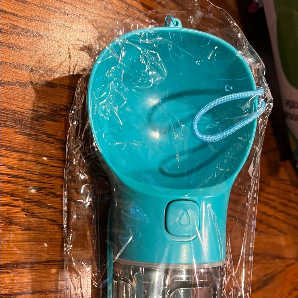 Pet Multifunctional Water Bottle with some little plastic bag inside New